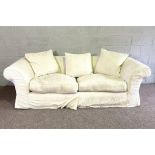 A large Chesterfield style three seat sofa, modern, with white cotton loose cover, 230cm long
