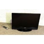 Small 32 inch Toshiba television (not tested), and a drinks trolley with ‘waggon’ style wheels,
