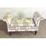 A modern upholstered window or bed end settee, with cushioned scrolled armrests and seat, with