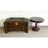 A modern Chinese chest with carved panels; together with a similar occasional table (2)