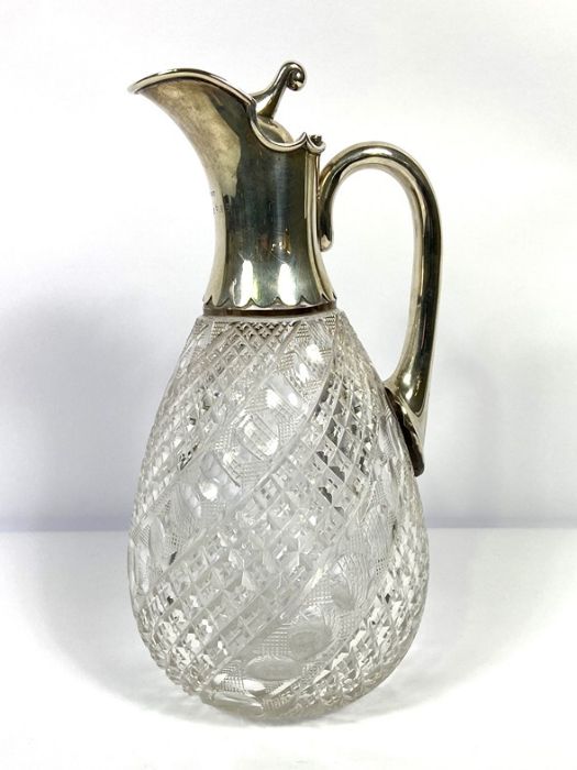 A silver mounted claret jug, hallmarked Birmingham 1919, with a pouring spout, hinged lid and scroll - Image 2 of 7