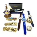 A small group of assorted modern watches, including a boxed Stauer watch; A Daniel Hechter