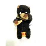 A Japanese tinplate and clockwork ‘Milk Bear’ figure, circa 1950/60, 124cm high