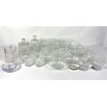 A large group of decorative moulded and cut table glass, including biscuit barrels, jugs, tazza