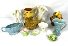 Mixed lot of ceramics, including a vase of fruit table centre, a slipware jug, triple spill vase and