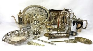 Assortment of plated tablewares, including a tea service, two embossed trays, night stick, biscuit