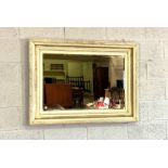 Four rectangular cream composition wall mirrors, with decorative mouldings in various sizes