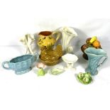 Mixed lot of ceramics, including a vase of fruit table centre, a slipware jug, triple spill vase and