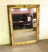 A large Continental composition gilt wall mirror, with a finely moulded rectangular frame and