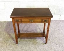 An Edwardian swivel topped folding card table, with three frieze drawers, 76cm high, 78cm wide
