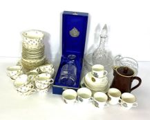 An assortment of ceramics and glassware including two part tea services, a cased decanter and a