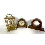 An assortment of clock parts, including enamel faces, together with various small clocks and a glass