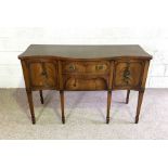 A George III style mahogany serpentine sideboard, late 20th century, with arrangement of drawers and