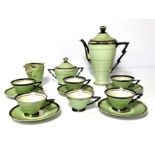 An Art Deco porcelain tea service, mid 20th century, of tapered form with a lime green ground and