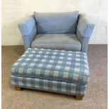 A large modern settee style armchair and matching footstool, currently upholstered in blue and white