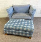 A large modern settee style armchair and matching footstool, currently upholstered in blue and white