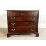 A George III provincial mahogany chest of drawers, 18th century, with three short drawers over three