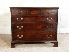 A George III provincial mahogany chest of drawers, 18th century, with three short drawers over three