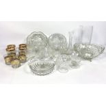 A large assortment of household and decorative glassware, including cut crystal glasses, vases