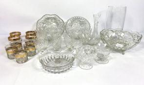 A large assortment of household and decorative glassware, including cut crystal glasses, vases