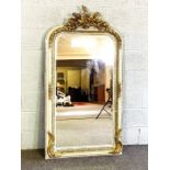 A George II style composition gilt wall mirror, late 20th century, with ornate cresting and bevelled