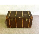 A vintage overseas travel trunk, with wood bindings, 90cm wide.