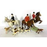 A group of hunting related Beswisk figures, including a jumping foxhunter (868); huntsman; lady on a