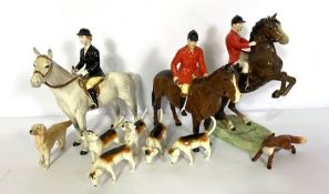 A group of hunting related Beswisk figures, including a jumping foxhunter (868); huntsman; lady on a