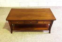 A modern mahogany coffee table, with six small frieze drawers, curved legs and undertier, 50cm high,