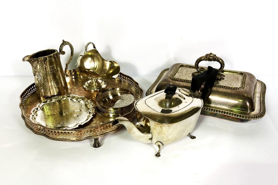 A small group of miscellaneous items, including a collection of silver plate, with a tea pot, jug