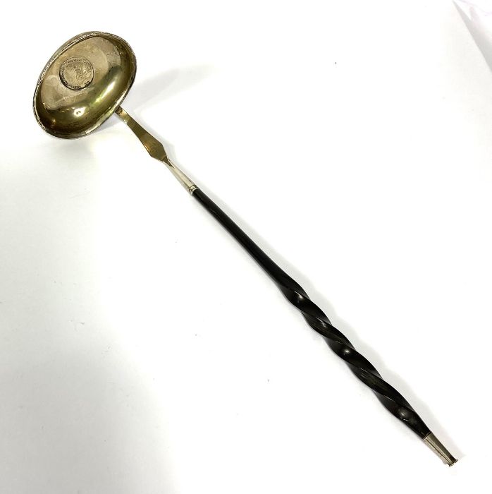 A Regency silver and baleen toddy ladle, the bowl inset with a silver 1811 token, with a twist - Image 2 of 5