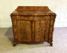 A Continental mahogany chiffonier, circa 1900, possibly German, of serpentine form, with two