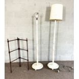 A group of assorted hanging light fittings, two white painted standard lamps, a towel rail and