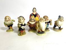 A rare complete set of Beswick pottery figures of Walt Disney’s Snow White & The Seven Dwarfs, circa
