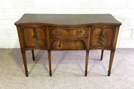 A George III style mahogany serpentine sideboard, late 20th century, with arrangement of drawers and