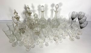 A large assortment of glassware, including two pairs of decanters, cordial glasses, brandy bowls etc