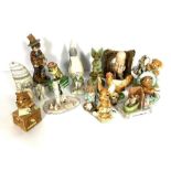 An assortment of novelty figures, including a Spode decorative box, in the form of a dog, dressed as