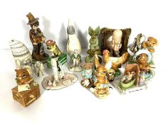 An assortment of novelty figures, including a Spode decorative box, in the form of a dog, dressed as