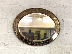 An Oval Regency style wall mirror, with divided plates, 75cm wide; together with a modern plaque