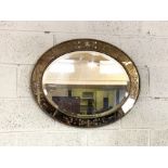 An Oval Regency style wall mirror, with divided plates, 75cm wide; together with a modern plaque