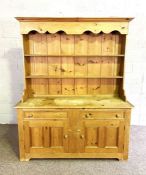 A vintage Lancashire style pine dresser, 20th century, with a two shelf rack, over two drawers and