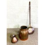 A group of items including a Victorian copper bed warmer; a copper cider jug and a large copper