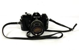 A Nikkon Nikkormat 35mm EL SLR camera, with a Nikkor 43mm-86mm telephoto lens; also Nikkor 135mm and