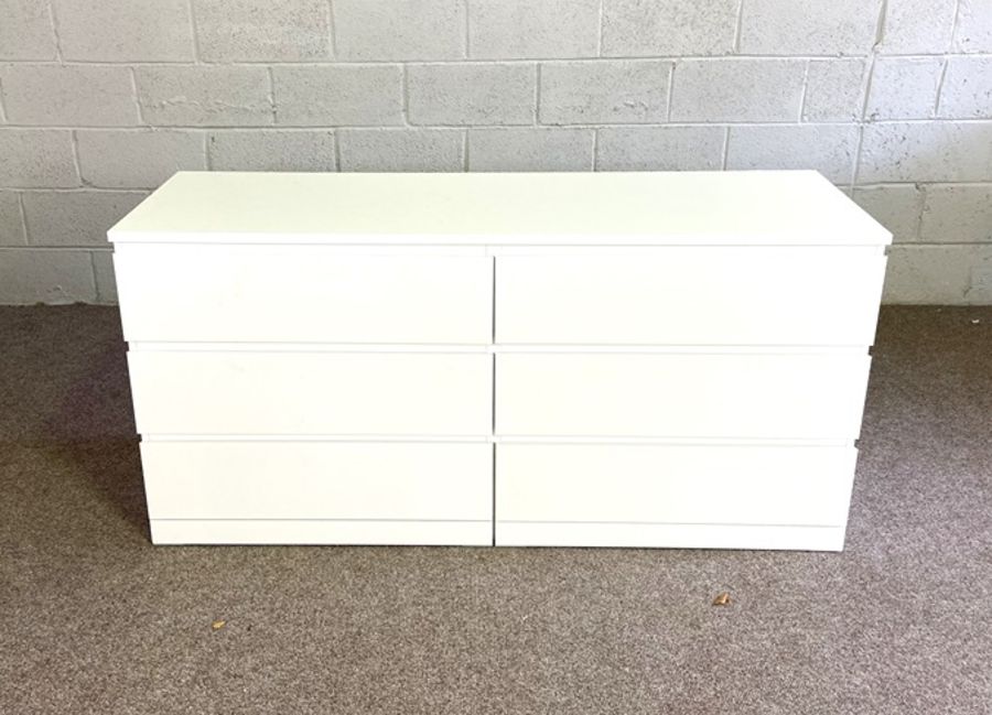 A modern white chest of six drawers, 78cm high, 163cm wide; and a similar cabinet (2)
