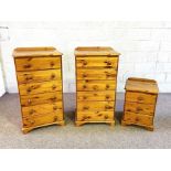 A pair of modern pine chest of drawers, each with six drawers, 111cm high; together with a smaller