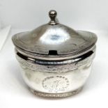 A Regency silver mustard pot, hallmarked Thomas Robins, London 1802, of oval waisted form with a