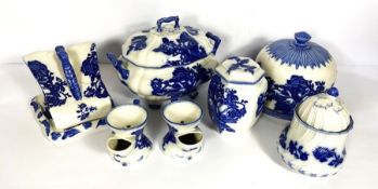 A group of Blakeney blue and white serving dishes, including a covered cheese dish, cake stand,