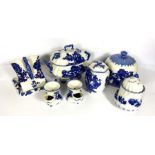 A group of Blakeney blue and white serving dishes, including a covered cheese dish, cake stand,