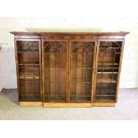 A George III style breakfront bookcase, 19th century (top section only), with a moulded cornice,