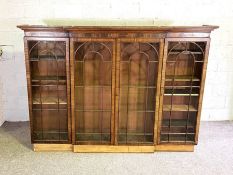 A George III style breakfront bookcase, 19th century (top section only), with a moulded cornice,